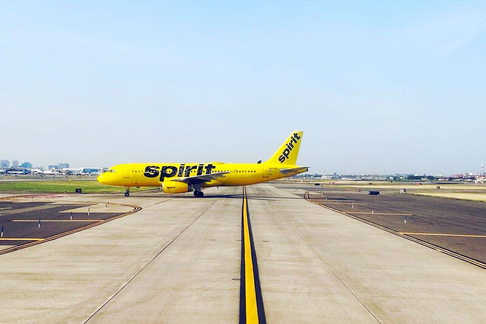 A Spirit Airlines Airplane on the Runway at an Airport, in New Jersey, USA - Cheapest Time