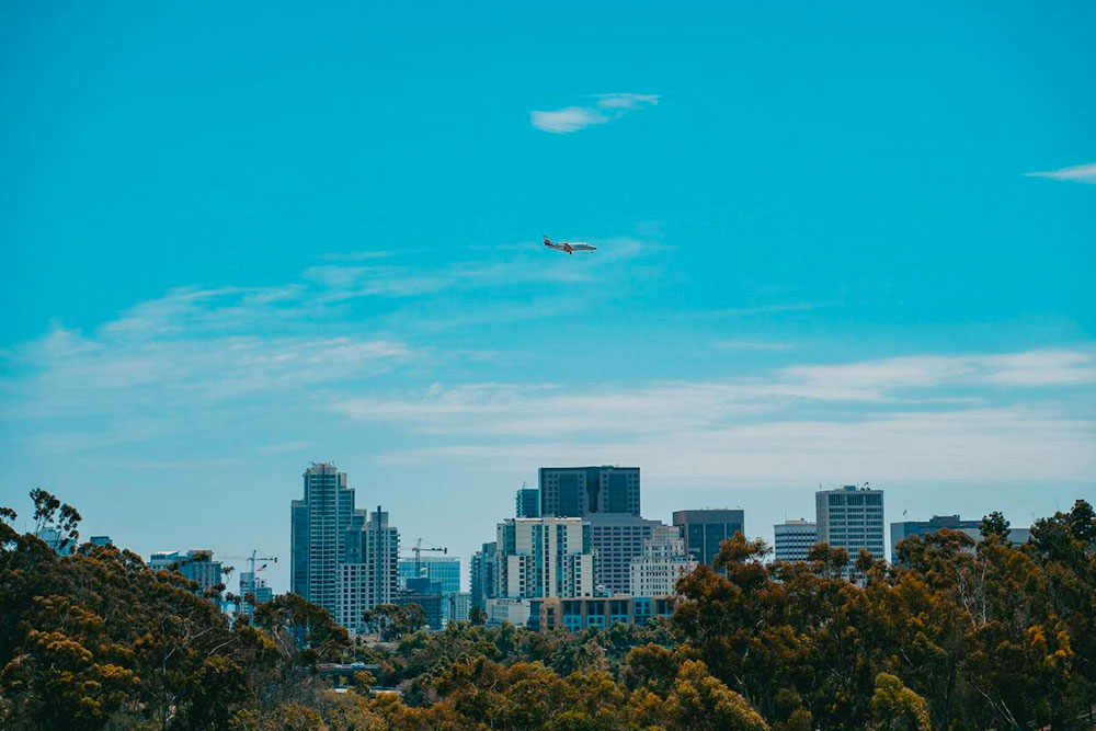 Plane Flying Over the City of San Diego - Cheapest Time